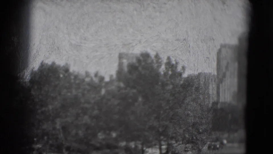 1975 Washington, DC frame with trees in the foreground and block-like buildings beyond, softened by black-and-white 8mm grain.