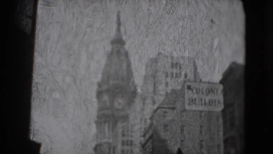 1975 Washington, DC 8mm frame showing a soft, grainy view of tall buildings, a tower form, and a Colonie Building sign.