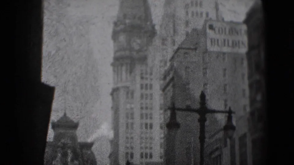 1975 Washington, DC frame with a tall towered facade, ornate street lamps, and the Colonie Building sign in a grainy street view.