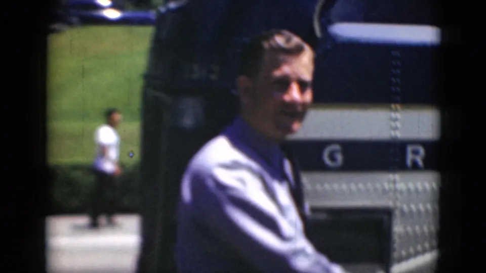 A man in a light shirt appears near the bus side in Middletown, Pennsylvania, with partial lettering visible on the vehicle.