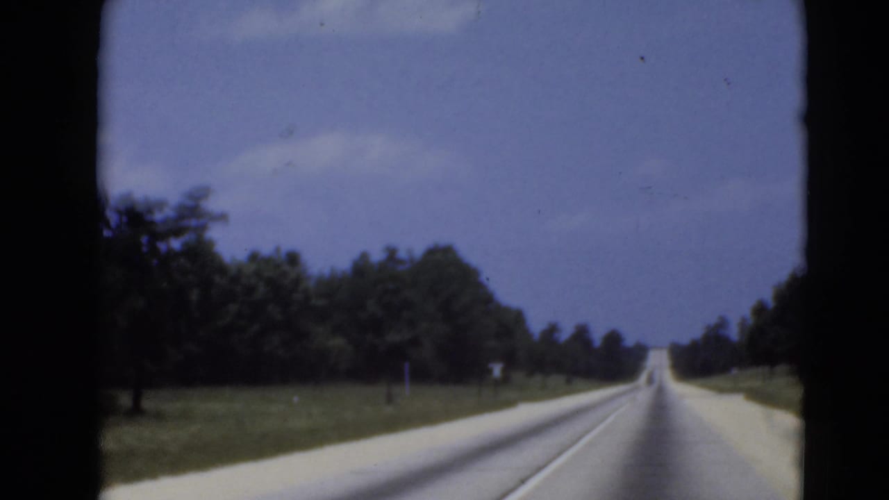 1940s cataloged 8mm frame showing a rural road from a moving vehicle near Middletown, Pennsylvania.