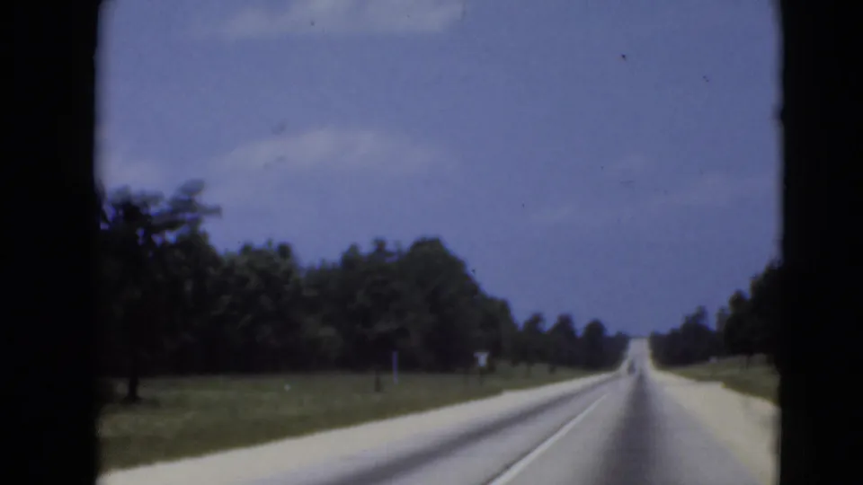 1940s cataloged 8mm frame showing a rural road from a moving vehicle near Middletown, Pennsylvania.
