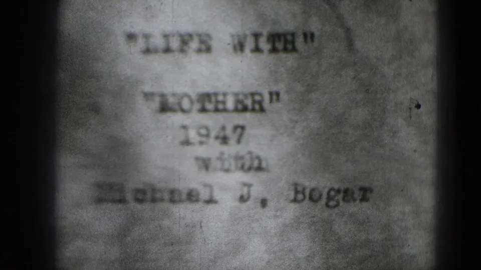Soft black-and-white 8mm frame with typed text reading “LIFE WITH MICHAEL,” a 1947 date, and a name line below.