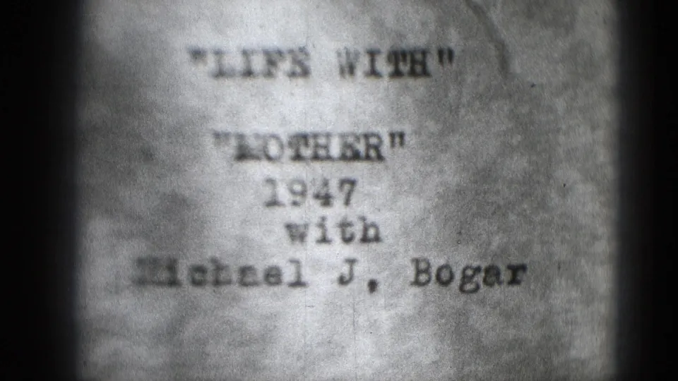 Grainy 8mm title-card frame showing LIFE WITH MOTHER, the visible date 1947, and Michael J. Bogar.