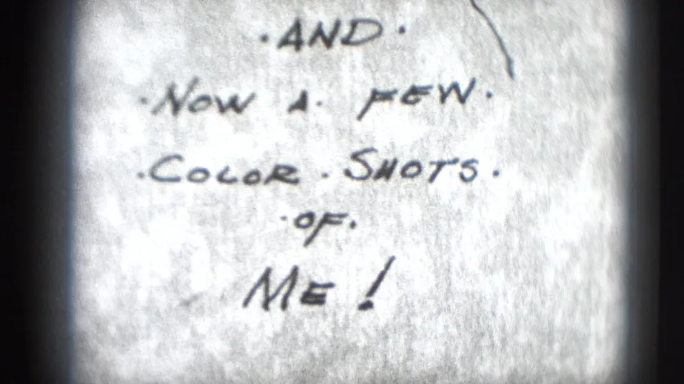 Close view of handwritten leader text on the 8mm reel reading, “AND NOW A FEW COLOR SHOTS OF ME!”