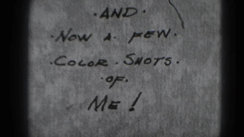 Darker 8mm frame showing the same handwritten leader note about a few color shots of “me.”