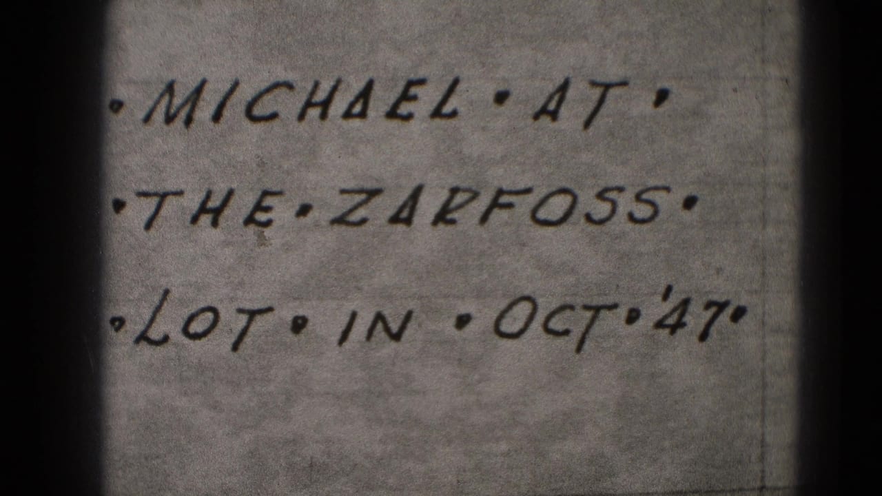 Close-up 8mm frame of a handwritten note naming Michael, the Zarfoss lot, and Oct '47, from Middletown, Pennsylvania metadata.