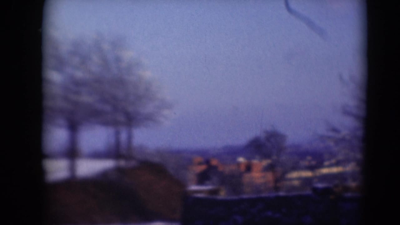 Soft 8mm view toward distant rooftops and trees, likely part of a Middletown, Pennsylvania home-movie landscape sequence.