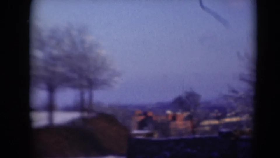 Soft 8mm view toward distant rooftops and trees, likely part of a Middletown, Pennsylvania home-movie landscape sequence.