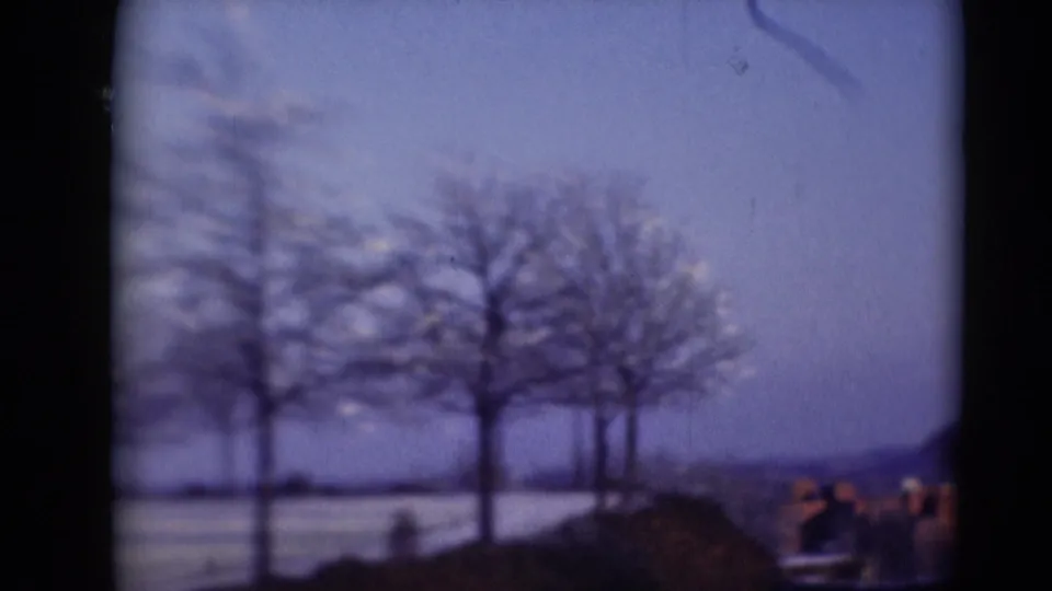 Soft 8mm view of a snow-covered landscape in Middletown, Pennsylvania, with bare trees and distant low forms.