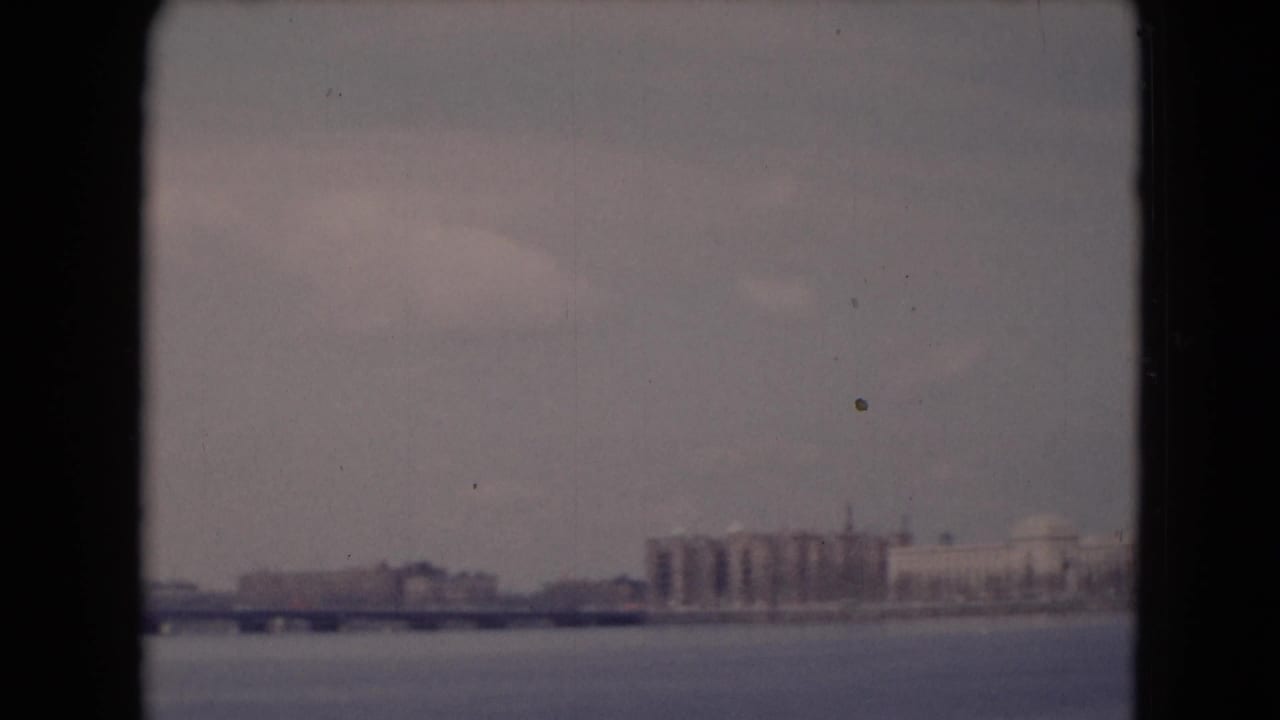 1948 8mm frame showing a bridge and distant waterfront structures near Middletown, Pennsylvania, with open water below.