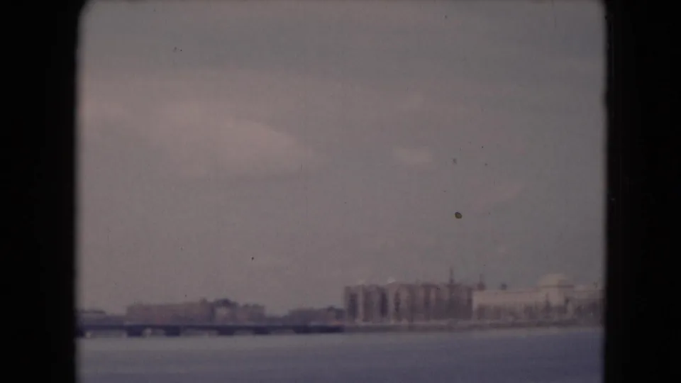 1948 8mm frame showing a bridge and distant waterfront structures near Middletown, Pennsylvania, with open water below.