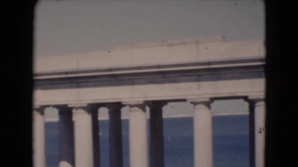 Soft 8mm frame from a Middletown, Pennsylvania home movie showing a partial architectural structure with columns or wall details.
