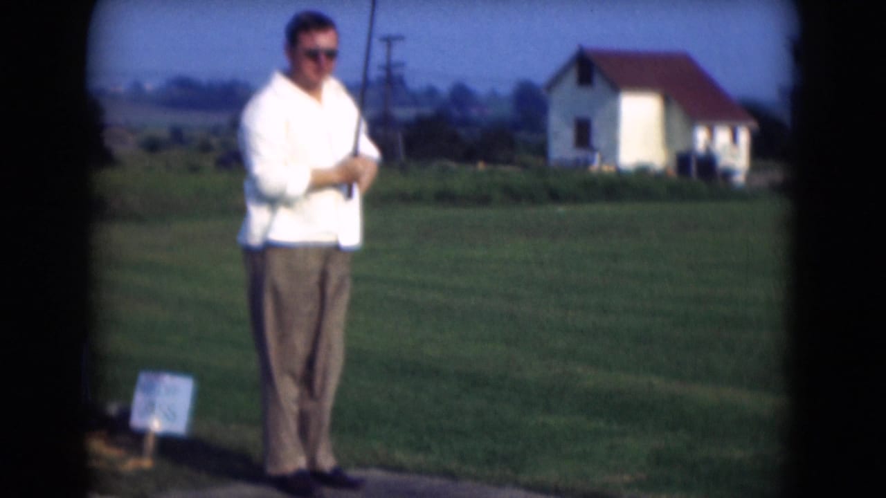 The 1975 Middletown footage shows the golfer standing upright with his club before a swing, framed by open grass and a house.
