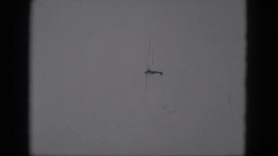 The distant aircraft remains visible as a small dark form against the sky in the final sampled frame.