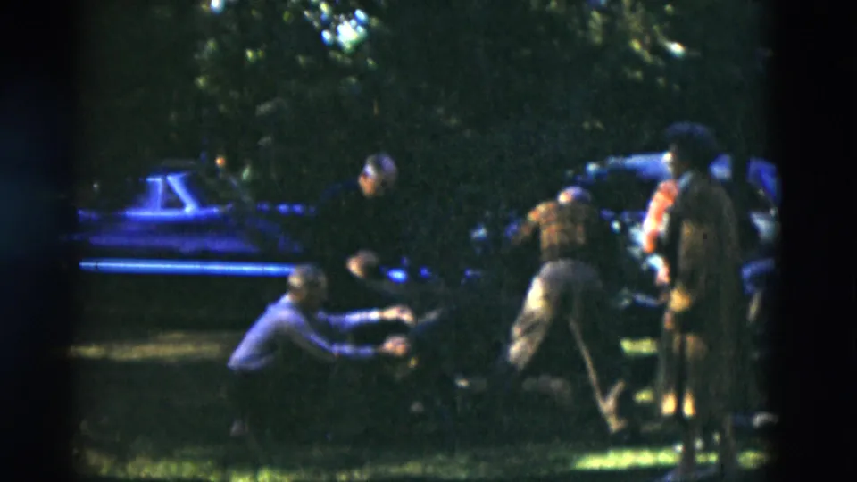 The final frame shows adults near a parked car in a shaded wooded setting in Somerset, Kentucky, filmed on 8mm in 1975.