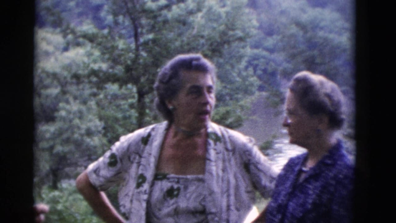 Two older women in 1970s home-movie footage converse in a wooded outdoor setting in Somerset, Kentucky.