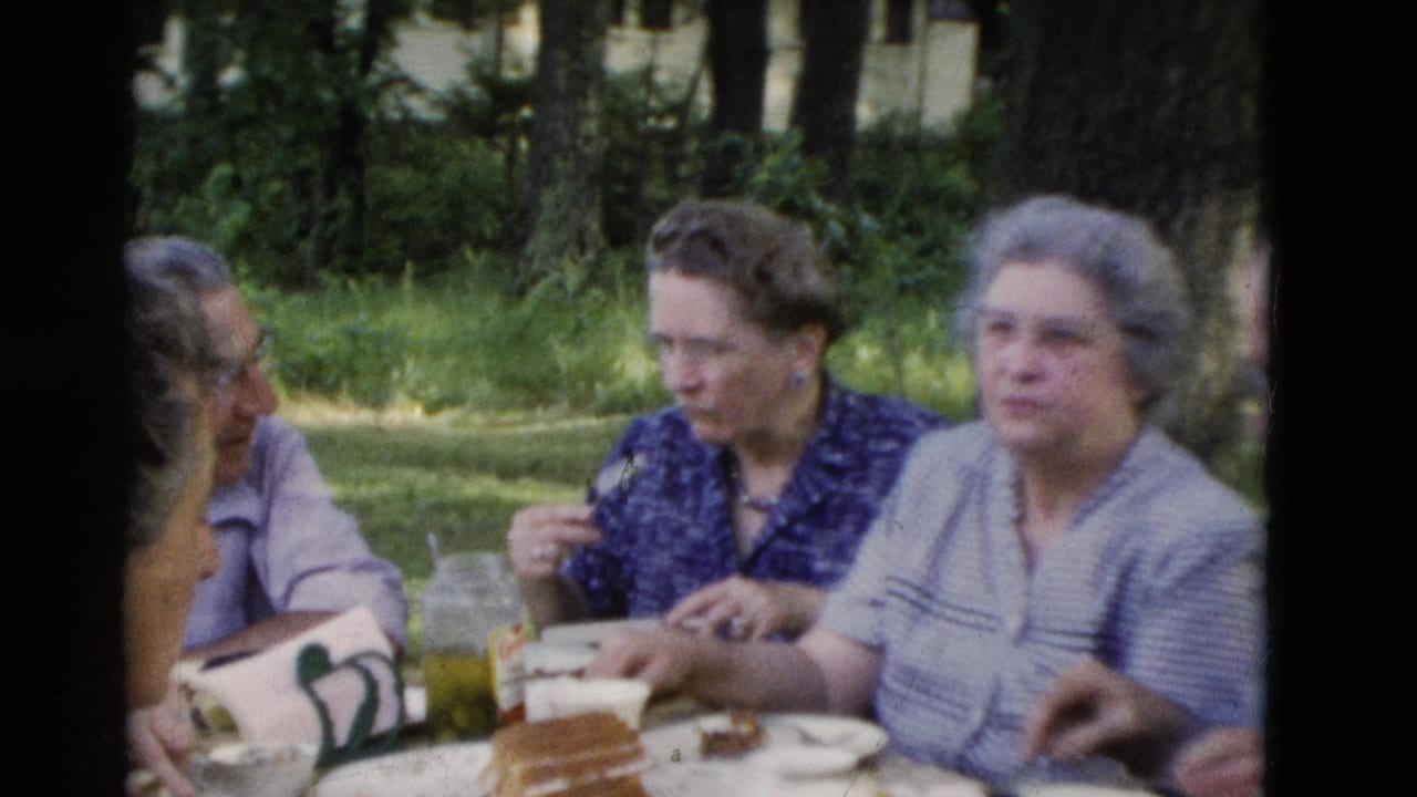 1975 Somerset, Kentucky frame with older women seated at a shaded picnic table while others remain partly visible nearby.