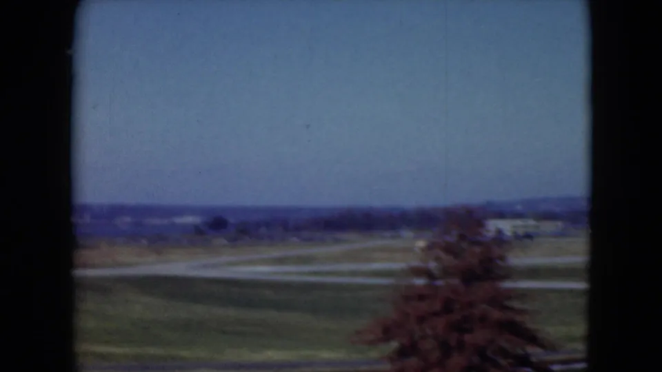 1975 Middletown, Pennsylvania frame showing open fields and roads, with a tree at the right edge and distant landscape on the horizon.