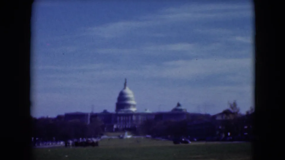 1975 8mm frame showing the Capitol dome and adjacent buildings from a distant public lawn in Washington, D.C.