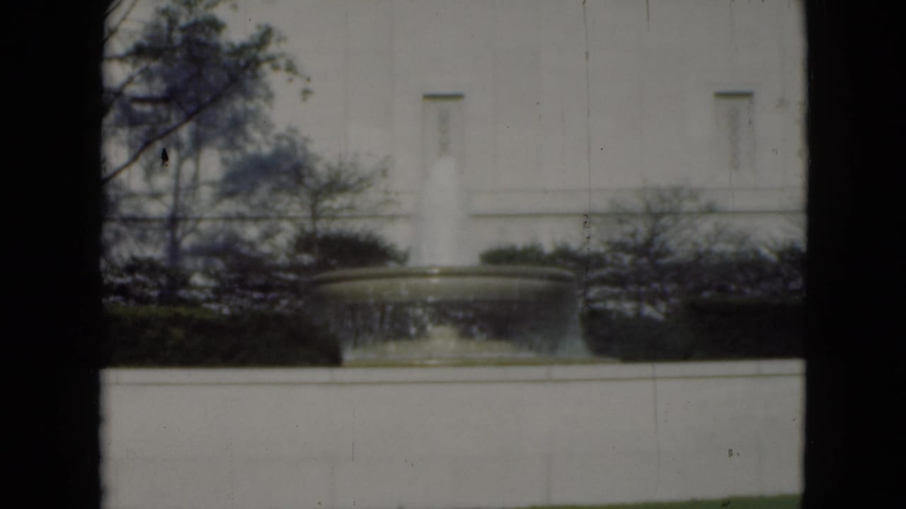 1975 Middletown, Pennsylvania view of the same outdoor fountain and pale building facade, softened by 8mm focus and dark frame borders.