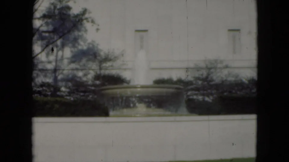 1975 Middletown, Pennsylvania view of the same outdoor fountain and pale building facade, softened by 8mm focus and dark frame borders.