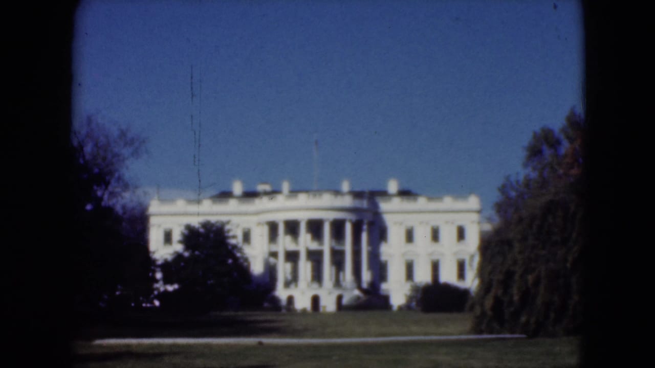 Cataloged 1975 Middletown, Pennsylvania frame of a white formal building with columns, seen from across manicured grounds.