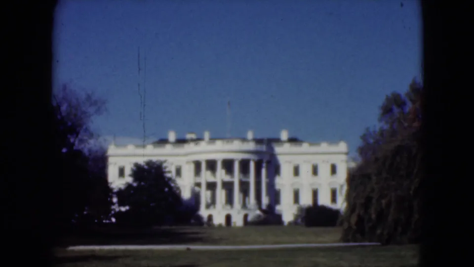 Cataloged 1975 Middletown, Pennsylvania frame of a white formal building with columns, seen from across manicured grounds.