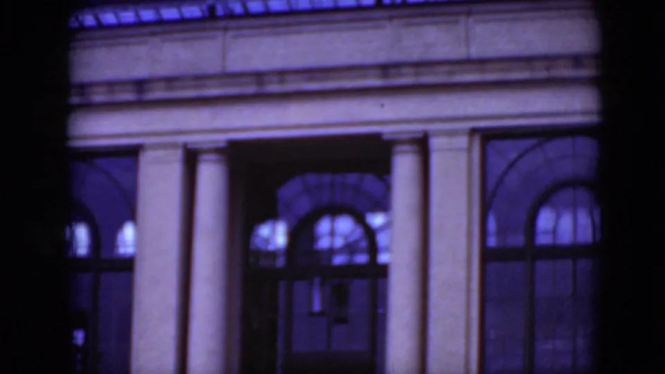 1975 Middletown, Pennsylvania 8mm frame showing a columned facade with arched windows and dark foreground edges.