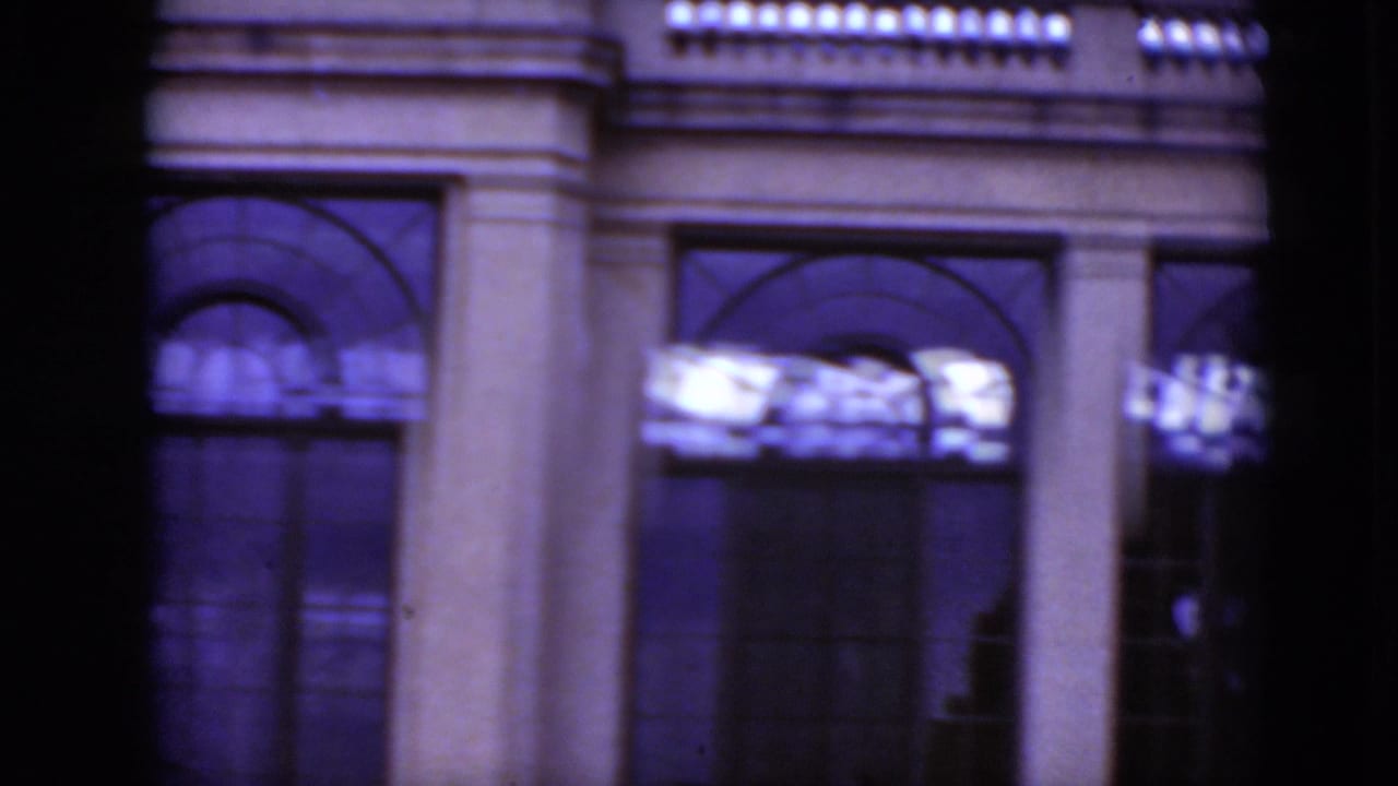1975 Middletown, Pennsylvania frame showing lower arched windows, a column and facade details on soft 8mm film.