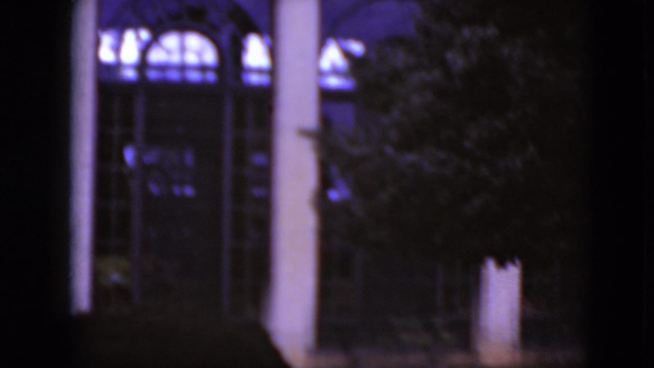 1975 Middletown, Pennsylvania 8mm view of columns, arched glass and a tree partially obscuring the facade.