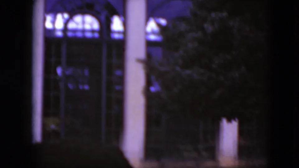 1975 Middletown, Pennsylvania 8mm view of columns, arched glass and a tree partially obscuring the facade.