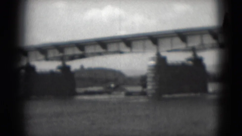 1975 8mm view in Middletown, Pennsylvania, showing a long bridge over water with stone-faced bridge structures and a distant shoreline.