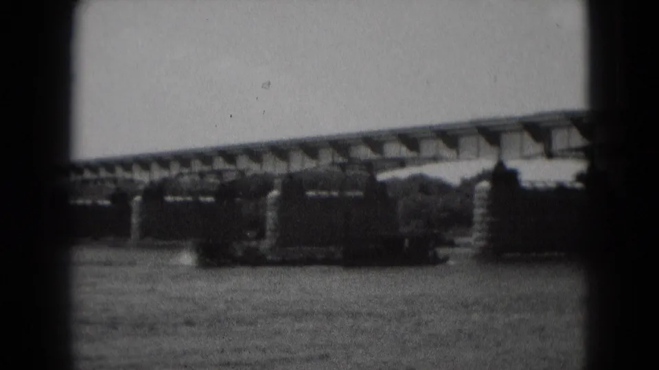 The vessel appears closer to the bridge supports as it moves across the river in the Middletown, Pennsylvania home-movie footage.