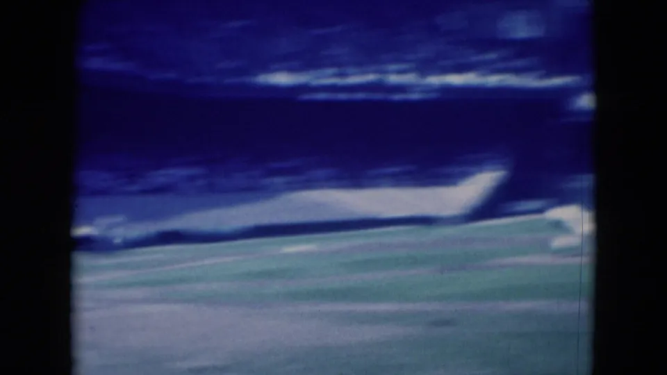 1975 8mm footage from Middletown, Pennsylvania appears to show a distant baseball field and stadium seating in soft focus.