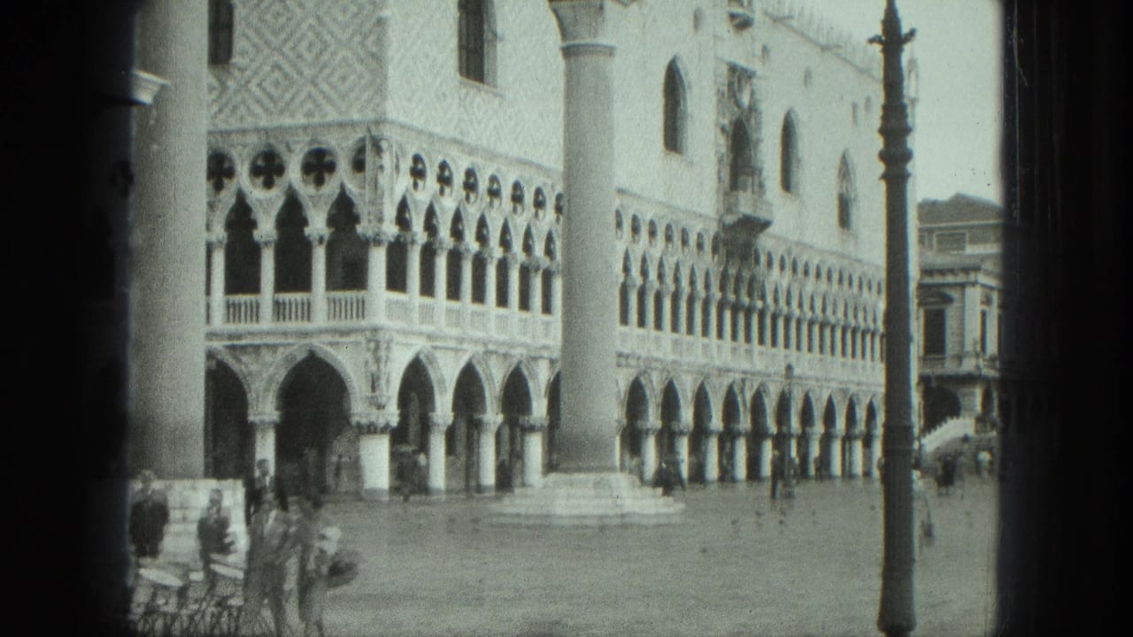 Doge's Palace arcades and piazza column with people in the square.