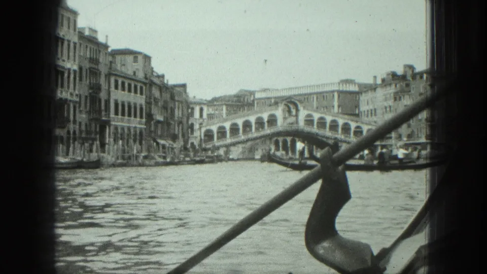 1975 Venice 8mm view of the Rialto Bridge across the canal, with the gondola ferro and rail in the foreground.