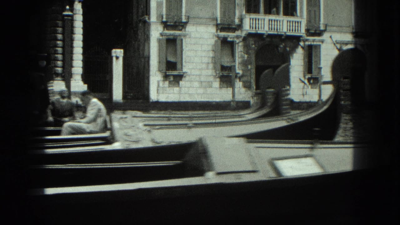 Gondola bow and canal-side buildings seen from a low angle.