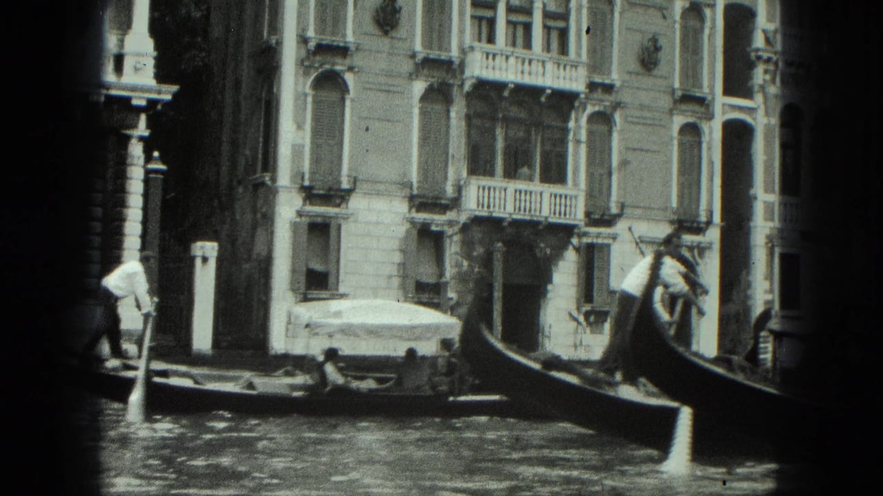 1975 Venice canal view with a gondolier steering past ornate palazzi, balconies, and striped mooring poles.