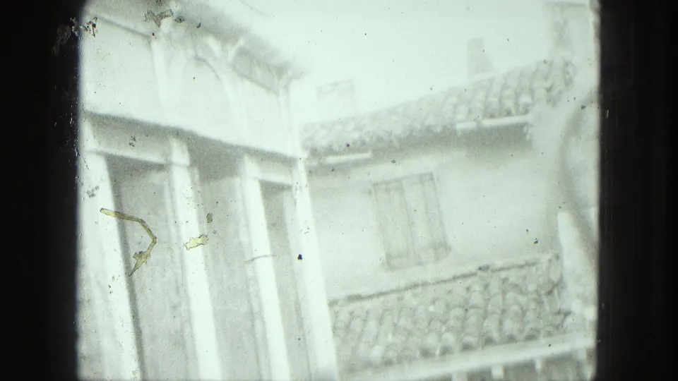 1975 Venice exterior with pale exposure, shuttered windows, a projecting corner, balcony detail, and roof tiles.