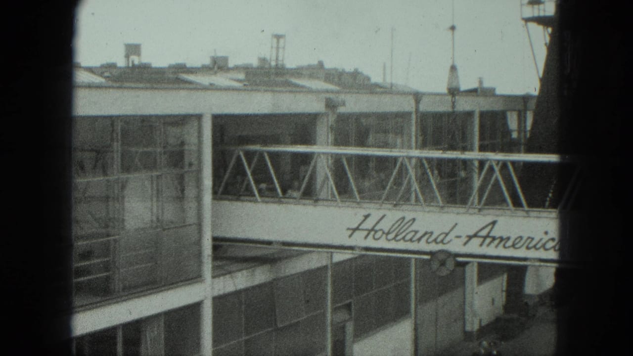 A 1975 Venice terminal view shows the Holland-America Line gangway partly blocked by dark vertical foreground bars.