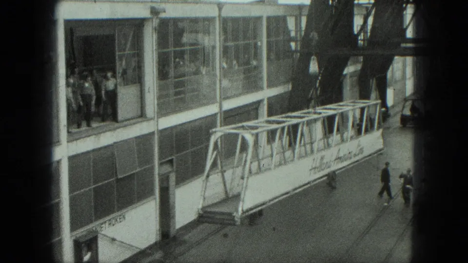 A later frame shows the gangway angled across the Venice terminal frontage with workers and structural beams nearby.
