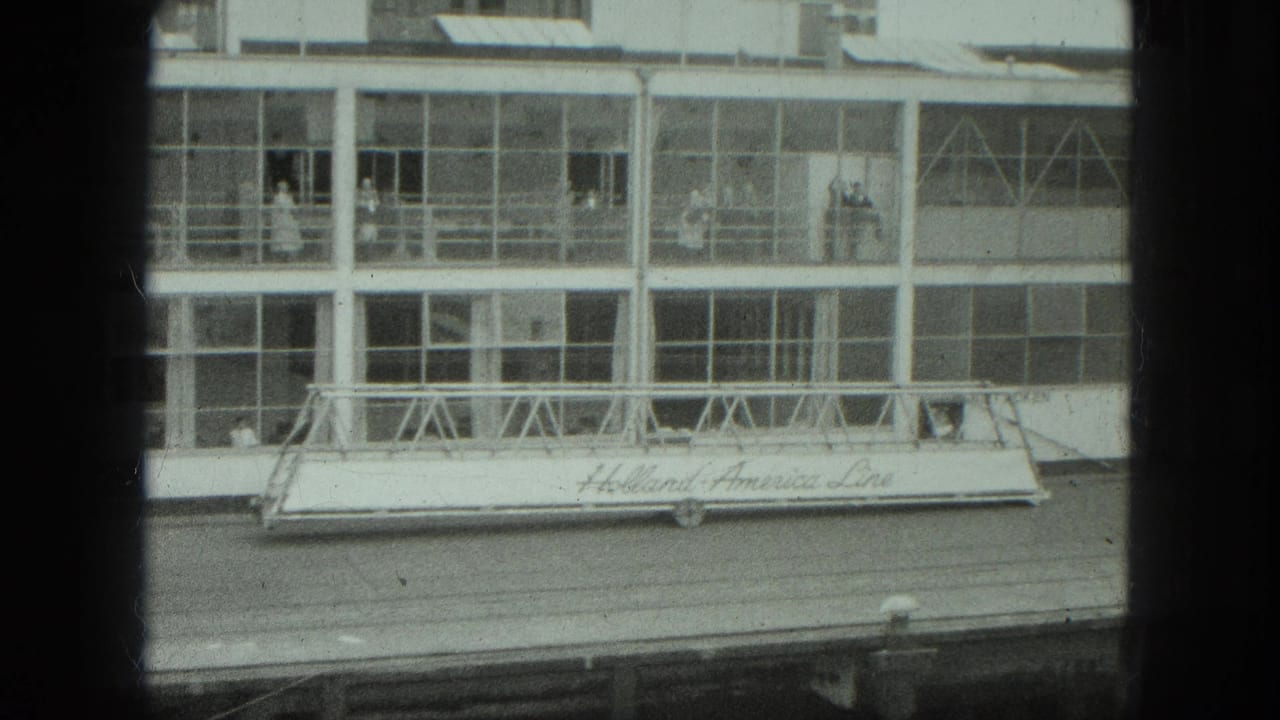 Glass-fronted dock building with Holland America Line lettering on a gangway.