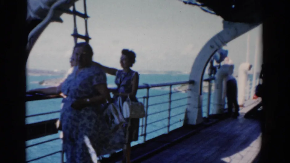 Three women passengers stand on a Florida cruise ship deck in 1975, looking over the railing toward the water.