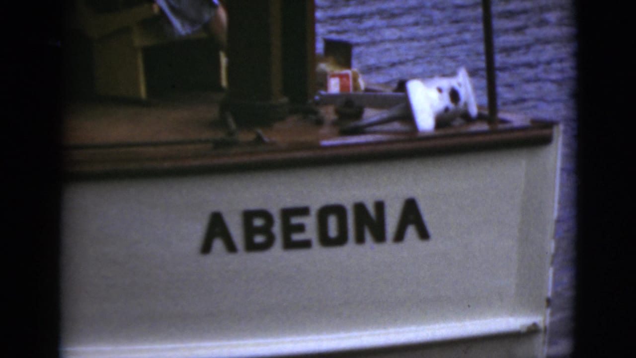 Boat stern or cabin area with the name Abeona visible.