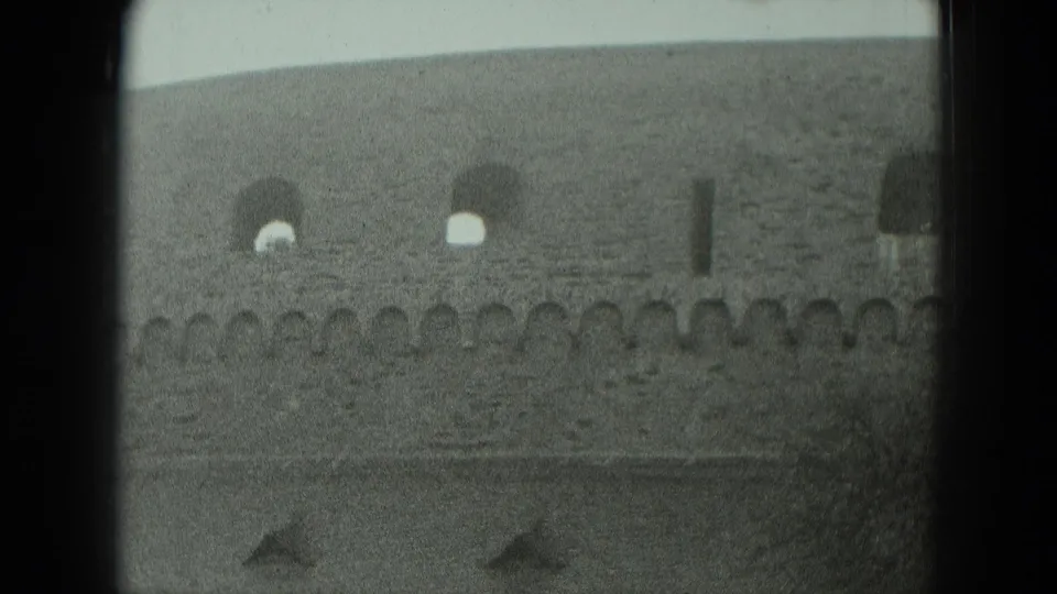 1951 West Germany frame showing a masonry rail or bridge structure with arched openings and soft 8mm film grain.