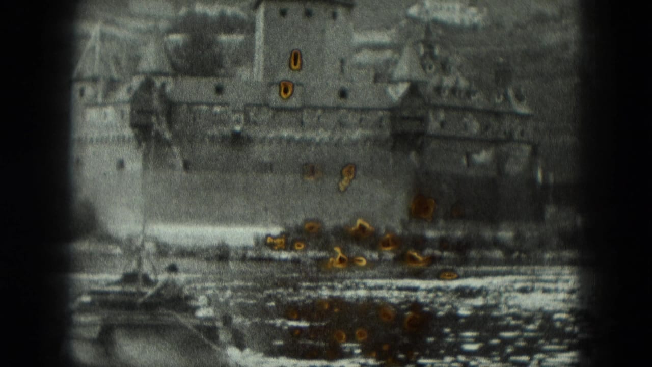 River view with a large stone castle or fortress above the waterline.