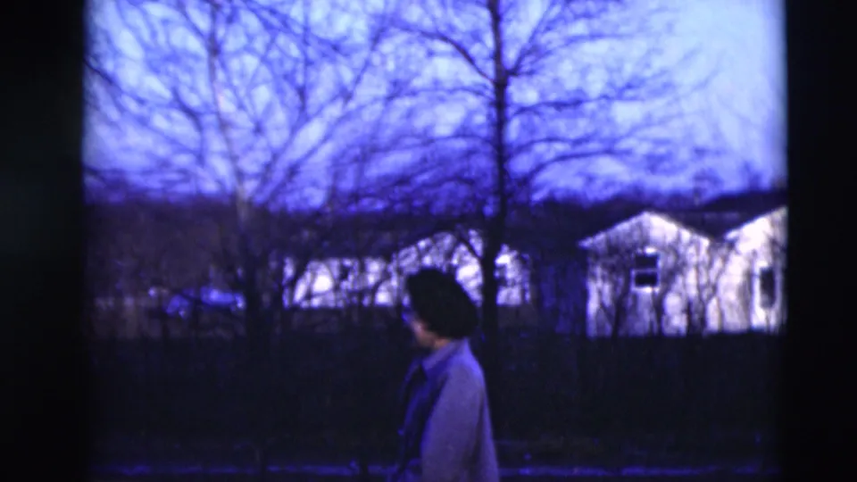 The final view shows a woman in the foreground with bare trees and small houses across the street in Paducah.