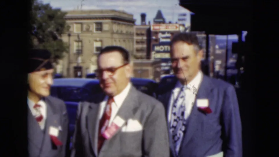 A 1951 Paducah street view shows three suited men with badges posing casually near cars and commercial buildings.