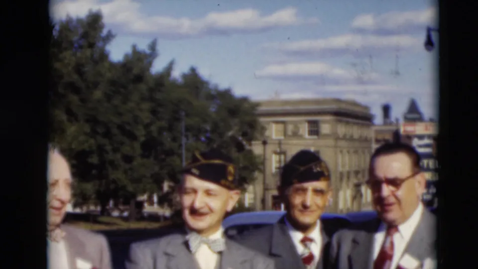A closer 1951 Paducah street view shows suited men, two caps, partial figures at the edges, a parked car, trees, and a visible hotel sign.